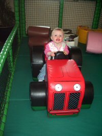 Baby, Young Child on Tractor at Farmer Palmers